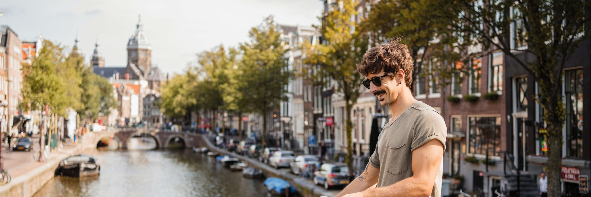 Man riding bike through Amsterdam.